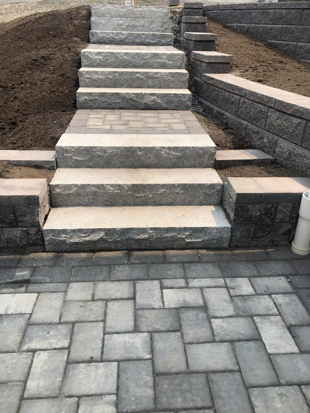 Granite bench seat set into a natural stone wall