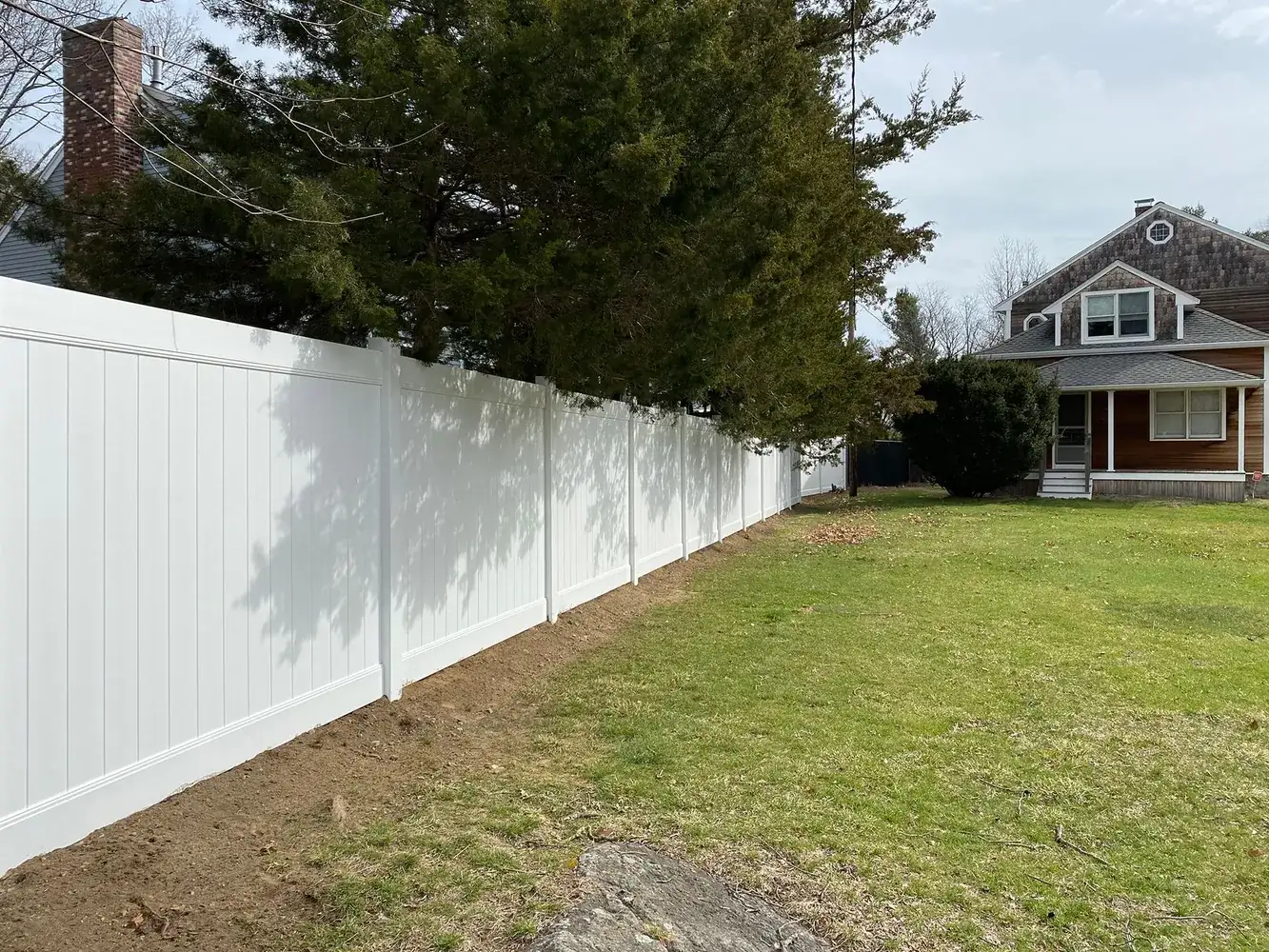 Vinyl privacy fence along a property line